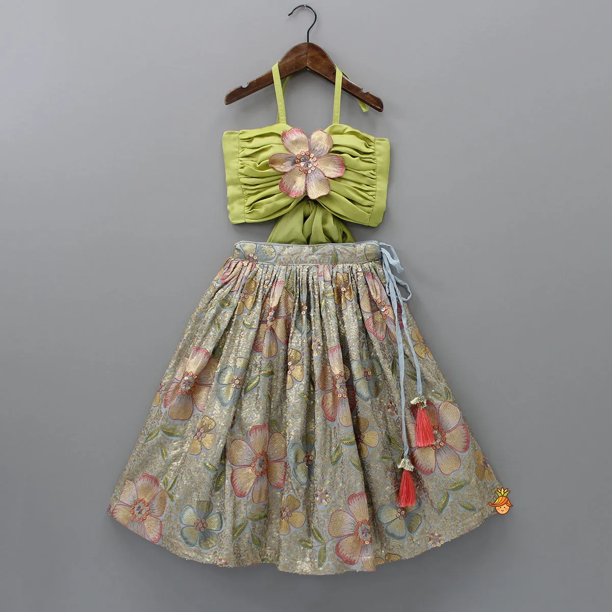 Pre Order: Back Knot Detail Stylish Green Floral Top And Heavy Sequins Embroidered Lehenga With Bow Hair Clip