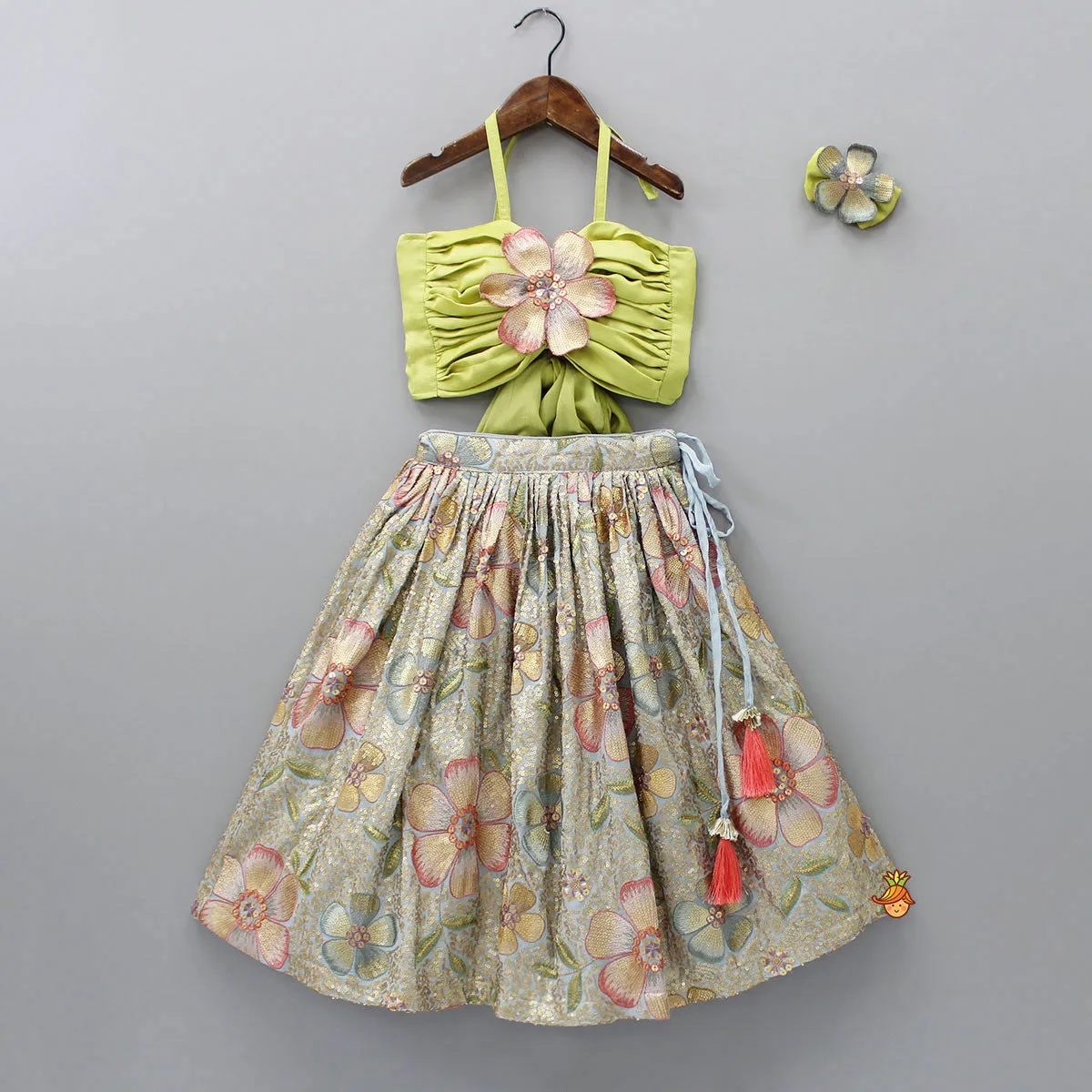 Pre Order: Back Knot Detail Stylish Green Floral Top And Heavy Sequins Embroidered Lehenga With Bow Hair Clip